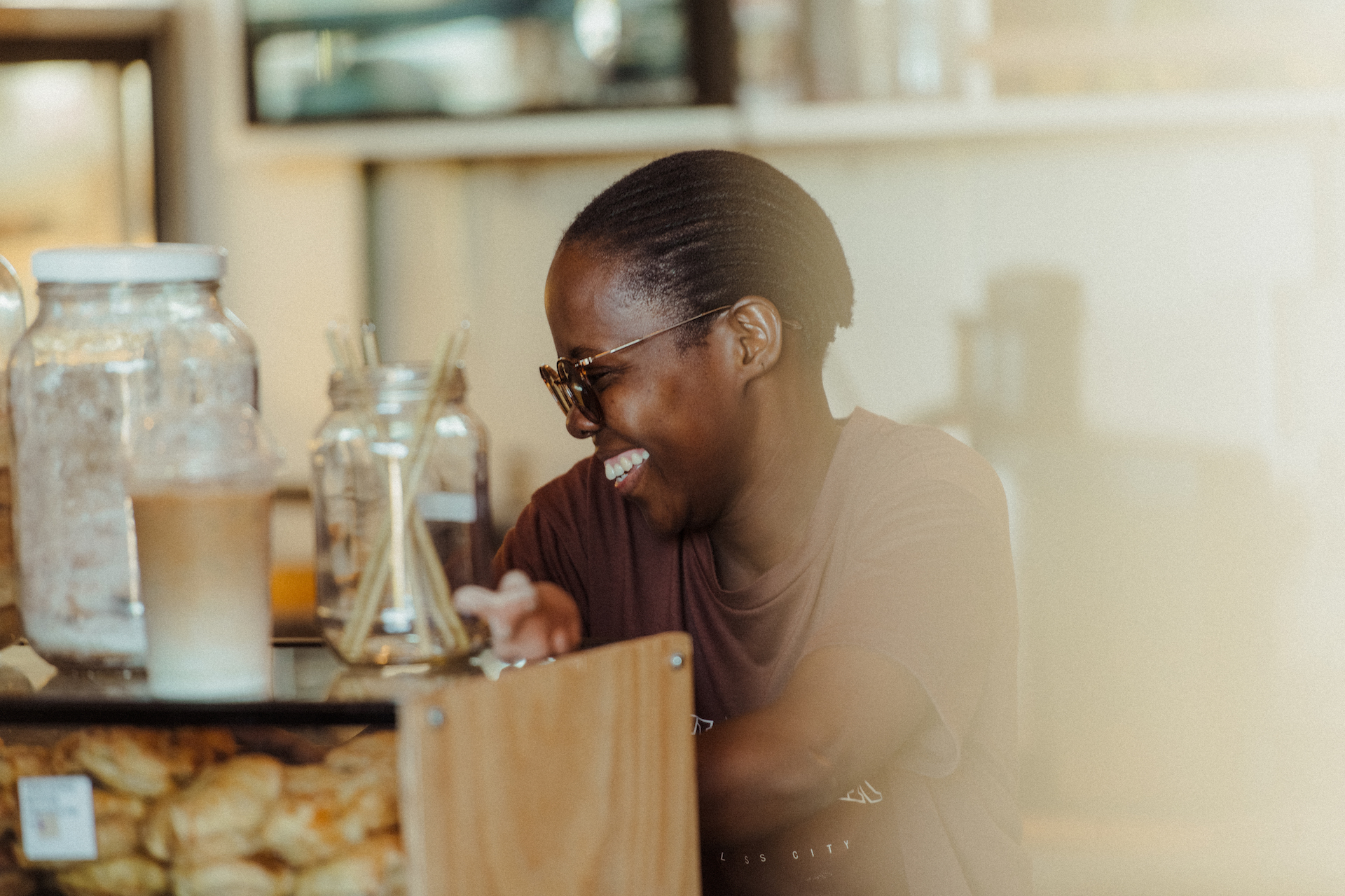 Woman smiling next to the cookie jar
