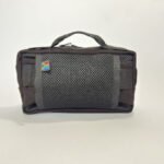 The back of a Kota Moon handlebar bag in black, blue, orange on a white background