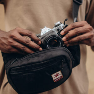 Killat Wax Moon camera bag on the chest with camera