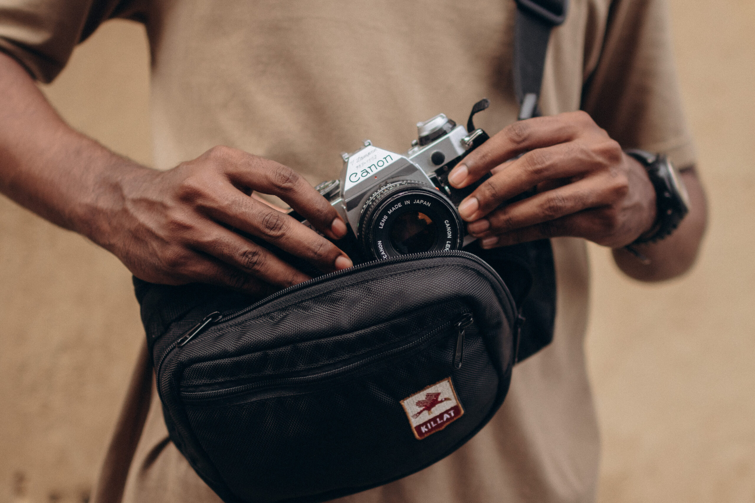 Killat Wax Moon camera bag on the chest with camera