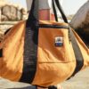 The Weekender sand duffle bag on Cape Town beach.