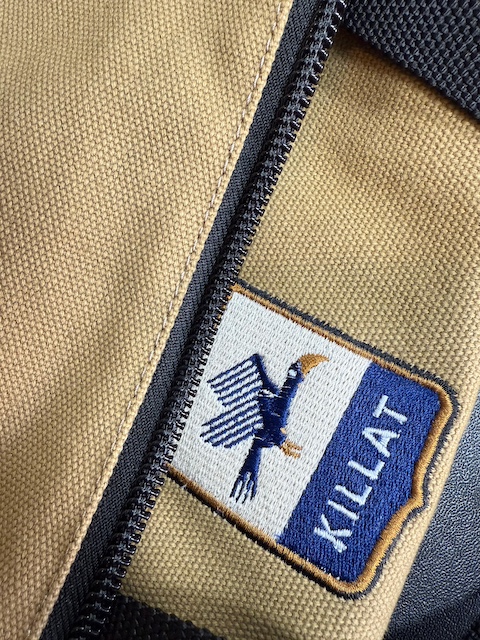 Detail shot of Killat logo of the Weekender sand duffle bag.